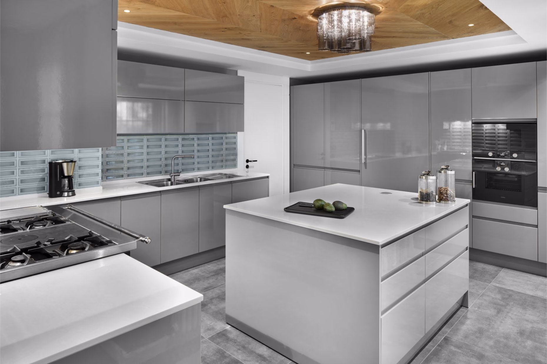 A modern kitchen island with a light Belenco worktop