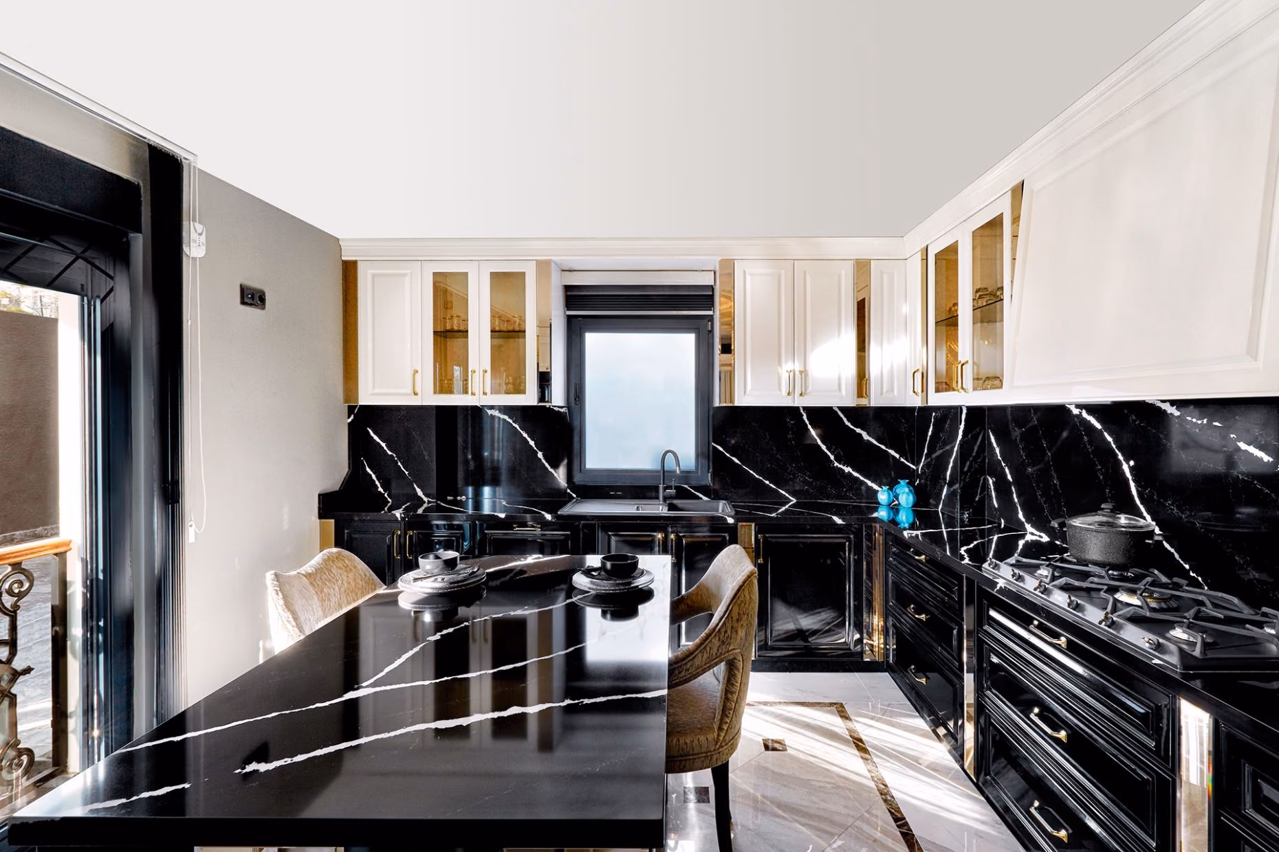 A dark kitchen with a black marble-pattern Belenco worktop and splashback